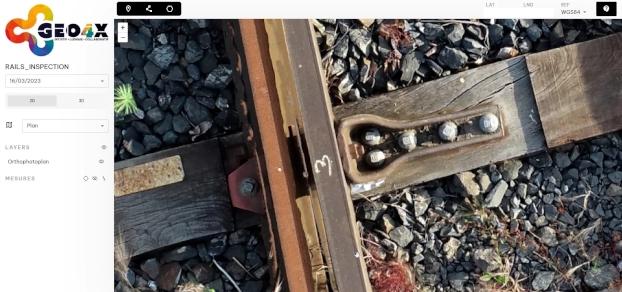 Detailed zoom at the millimeter level on a railway incident for fine analysis.